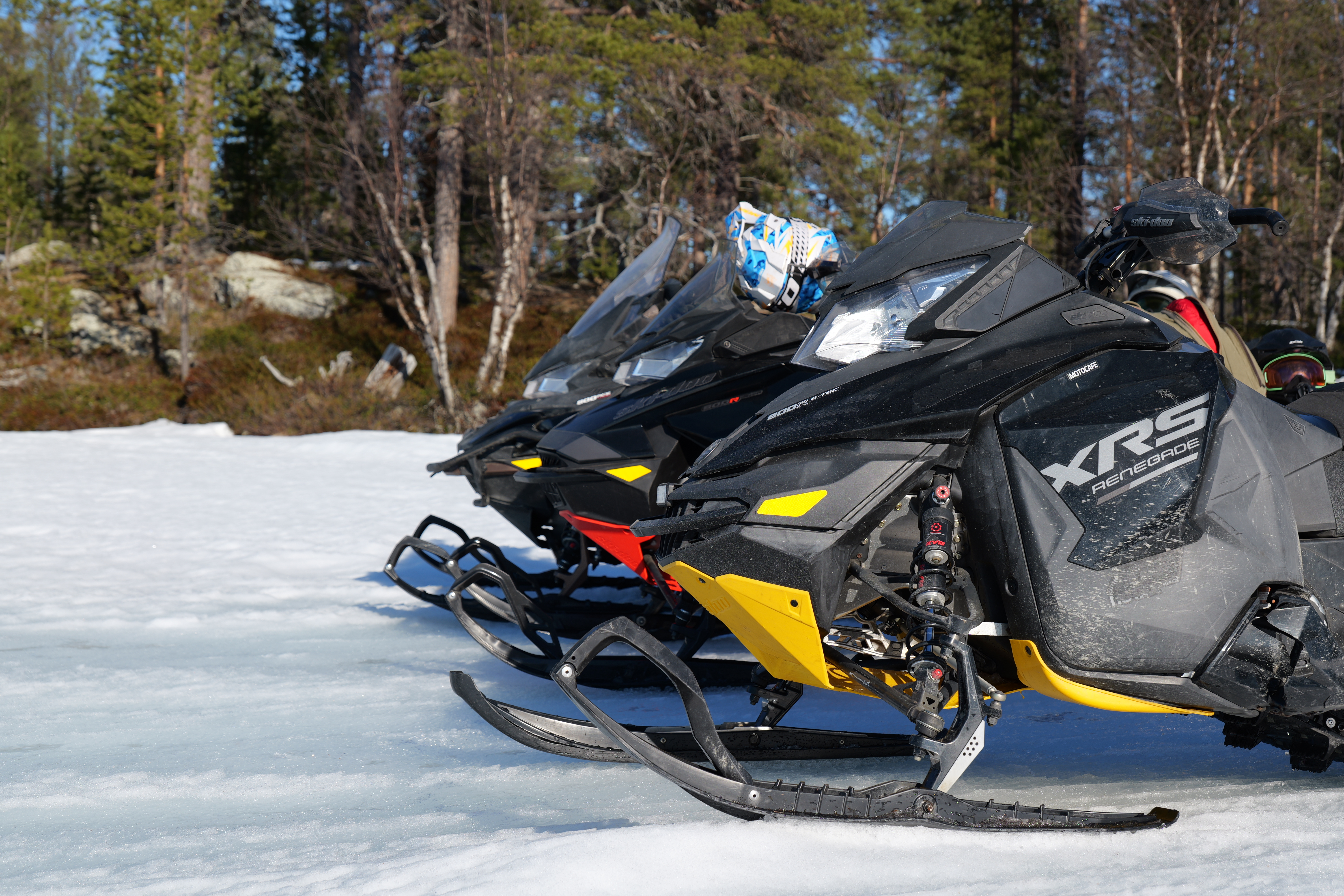 Snowmobiles ready for a private wilderness day